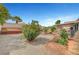 Well maintained backyard with landscaping, plants, and trees at 6131 Cozy Creek St, North Las Vegas, NV 89031