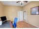 Bedroom with hardwood floors, ceiling fan, and closet for ample storage at 6131 Cozy Creek St, North Las Vegas, NV 89031