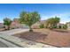 Expansive front yard showcasing mature trees and meticulous landscaping at 6131 Cozy Creek St, North Las Vegas, NV 89031