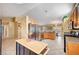 Spacious kitchen featuring stainless steel appliances and a functional island at 6131 Cozy Creek St, North Las Vegas, NV 89031
