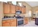 Well-equipped kitchen featuring stainless steel appliances and sleek countertops at 6131 Cozy Creek St, North Las Vegas, NV 89031