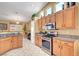 Bright and spacious kitchen with stainless steel appliances and ample cabinet storage at 6131 Cozy Creek St, North Las Vegas, NV 89031