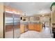 Open-concept kitchen with stainless steel appliances and a convenient breakfast bar at 6131 Cozy Creek St, North Las Vegas, NV 89031