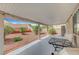 Covered patio with comfortable seating for relaxing and entertaining at 6131 Cozy Creek St, North Las Vegas, NV 89031
