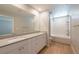 Modern bathroom with double sinks and a shower-tub combination at 6145 May River St, Las Vegas, NV 89148