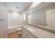 Modern bathroom with gray quartz counters, and a shower-tub combination at 6145 May River St, Las Vegas, NV 89148
