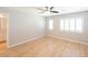 Spacious bedroom featuring hardwood floors, neutral walls, and shuttered windows at 6145 May River St, Las Vegas, NV 89148