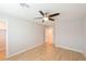 Empty bedroom with modern ceiling fan, light-colored walls, hardwood floors, and walk-in closet at 6145 May River St, Las Vegas, NV 89148