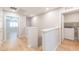 Upstairs hallway with laundry room and bedroom access at 6145 May River St, Las Vegas, NV 89148