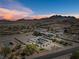Expansive aerial view of desert home showing unique architectural design and scenic mountain views at 647 Foxhall Rd, Henderson, NV 89002