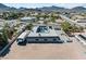 Overhead perspective of a home with a central courtyard pool and surrounding desert landscape at 647 Foxhall Rd, Henderson, NV 89002