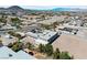 Panoramic aerial view of a property with a courtyard pool and expansive desert surroundings at 647 Foxhall Rd, Henderson, NV 89002
