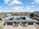 Captivating aerial perspective of house highlighting unique roof design and expansive driveway at 647 Foxhall Rd, Henderson, NV 89002