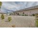 Backyard featuring minimal landscaping, a covered patio area, and a simple, clean design at 647 Foxhall Rd, Henderson, NV 89002
