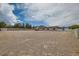 Expansive backyard area with desert landscaping, offering ample space and minimal features at 647 Foxhall Rd, Henderson, NV 89002