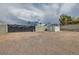 Gated lot featuring a detached storage building, mountain views, and lots of space at 647 Foxhall Rd, Henderson, NV 89002