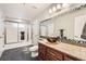 Bathroom featuring granite countertop, brown vessel sink, and tiled mirror frame at 647 Foxhall Rd, Henderson, NV 89002