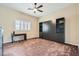 Bedroom with a ceiling fan, and window with shutters, and murphy bed with shelving at 647 Foxhall Rd, Henderson, NV 89002