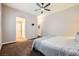 Cozy bedroom featuring neutral walls, ceiling fan, and plush carpeting for a comfortable retreat at 647 Foxhall Rd, Henderson, NV 89002