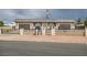 Inviting home featuring a well-maintained front yard, secure fencing, and a charming facade at 647 Foxhall Rd, Henderson, NV 89002