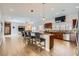 Open kitchen with stainless steel appliances, a breakfast bar, and views into the living room at 647 Foxhall Rd, Henderson, NV 89002