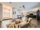 Open-concept living room boasting hardwood floors, comfortable seating and ample natural light at 647 Foxhall Rd, Henderson, NV 89002