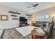 Cozy living room features comfortable seating, floating shelves, and a modern entertainment center at 647 Foxhall Rd, Henderson, NV 89002