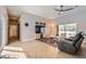 Bright living room boasts wood-look tile floors, recessed lighting, and a sliding glass door for natural light at 647 Foxhall Rd, Henderson, NV 89002
