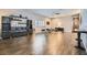 Expansive living room with hardwood floors, recessed lighting, and a custom bar area for entertaining guests at 647 Foxhall Rd, Henderson, NV 89002