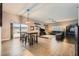 Bright living room with an eating area, modern furnishings and a large sliding glass door at 647 Foxhall Rd, Henderson, NV 89002