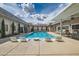 Sparkling pool with lounge chairs and covered patio, perfect for relaxing and entertaining at 647 Foxhall Rd, Henderson, NV 89002
