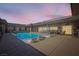 Sparkling pool with lounge chairs and covered patio, perfect for relaxing and entertaining at 647 Foxhall Rd, Henderson, NV 89002