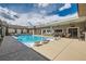 Inviting backyard pool with lounge chairs and lush landscaping, creating a relaxing atmosphere at 647 Foxhall Rd, Henderson, NV 89002
