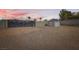 Large gated area with storage shed, offering secure storage for vehicles and equipment at 647 Foxhall Rd, Henderson, NV 89002