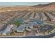Birds eye view of a community with pool, tennis courts, clubhouse, and walking trails with mountain views at 6700 Regency Stone Way, Las Vegas, NV 89148