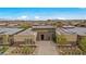 Expansive aerial view showcasing the home's landscaping and surrounding neighborhood at 6700 Regency Stone Way, Las Vegas, NV 89148