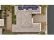 Aerial view showcasing home's tile roof, solar panels, landscaped backyard, and proximity to a paved driveway at 6700 Regency Stone Way, Las Vegas, NV 89148