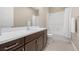 Bright bathroom showcasing a modern vanity, ample counter space, and shower at 6700 Regency Stone Way, Las Vegas, NV 89148