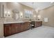 Bathroom features dual sinks, vanity, and marble floors at 6700 Regency Stone Way, Las Vegas, NV 89148
