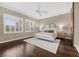 Bedroom features hardwood floors, ceiling fan, plantation shutters and neutral paint at 6700 Regency Stone Way, Las Vegas, NV 89148