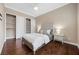 Inviting bedroom features hardwood floors, neutral decor, and closet storage at 6700 Regency Stone Way, Las Vegas, NV 89148
