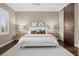 Bedroom features hardwood floors, ceiling fan, neutral paint and plantation shutters at 6700 Regency Stone Way, Las Vegas, NV 89148