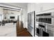 Kitchen features stainless steel appliances and white cabinets at 6700 Regency Stone Way, Las Vegas, NV 89148