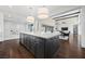 Bright kitchen features large island, white countertops and stainless steel appliances at 6700 Regency Stone Way, Las Vegas, NV 89148