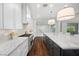 Bright kitchen features long countertop, white cabinets and stainless steel appliances at 6700 Regency Stone Way, Las Vegas, NV 89148
