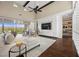 Inviting living room boasting built-in shelving, wood beams and natural lighting at 6700 Regency Stone Way, Las Vegas, NV 89148