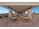 A fully equipped outdoor kitchen and seating area in a community setting at 6700 Regency Stone Way, Las Vegas, NV 89148