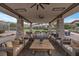 Cozy outdoor lounge area with comfortable seating and a relaxing atmosphere under a covered patio at 6700 Regency Stone Way, Las Vegas, NV 89148