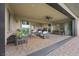 Expansive covered patio offers both dining and living areas for relaxation and entertaining at 6700 Regency Stone Way, Las Vegas, NV 89148