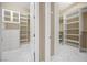 Spacious walk-in closet with custom shelving and drawers for optimal organization at 6700 Regency Stone Way, Las Vegas, NV 89148